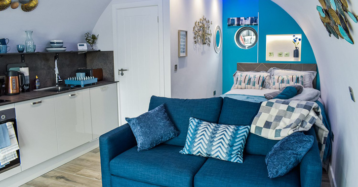 Internal view of Glamping pod bedroom and living room at Derecroft Glamping